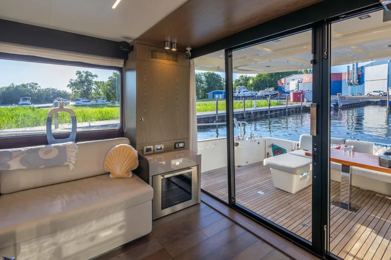 Slide: The Image of Luxurious interior of 2018 Cranchi Eco Trawler 53 Long Distance yacht with scenic marina view. - 145