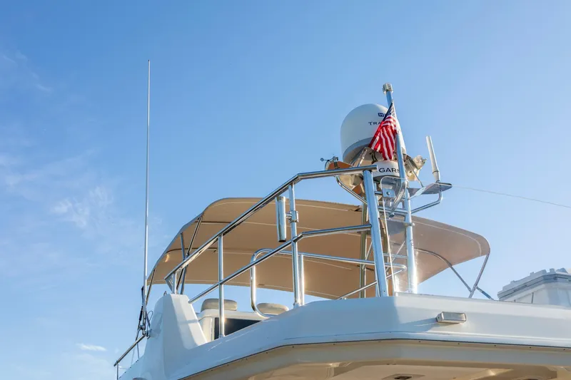 Slide: The Image of 2018 Cranchi Eco Trawler 53 Long Distance yacht with radar and American flag. - 15