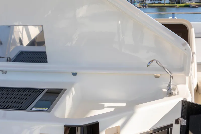 Slide: The Image of Cranchi Eco Trawler 53 Long Distance 2018 yacht deck with sink and grill area. - 18