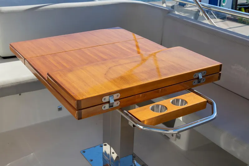 Slide: The Image of Wooden table with cup holders on 2018 Cranchi Eco Trawler 53 Long Distance yacht. - 24