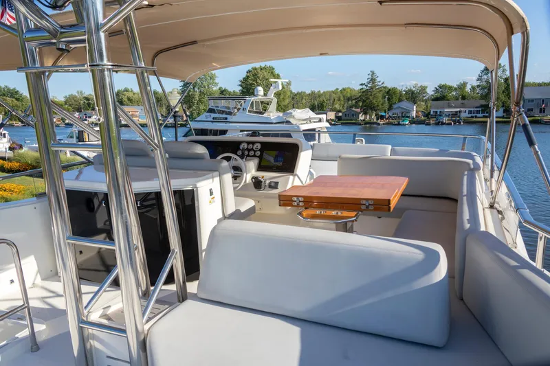 Slide: The Image of 2018 Cranchi Eco Trawler 53 Long Distance yacht interior with helm and seating area. - 25