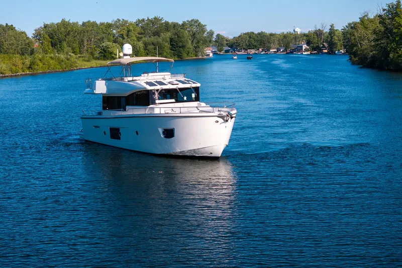 Slide: The Image of 2018 Cranchi Eco Trawler 53 Long Distance cruising on a serene river. - 3