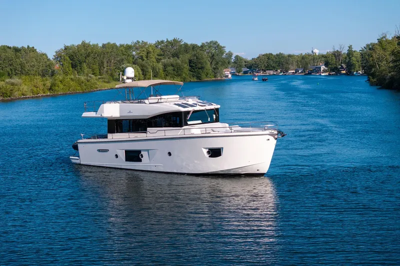 Slide: The Image of 2018 Cranchi Eco Trawler 53 Long Distance cruising on a serene river. - 5
