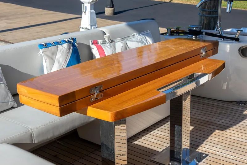 Slide: The Image of Wooden table on Cranchi Eco Trawler 53 Long Distance, 2018 model, with nautical-themed cushions. - 50