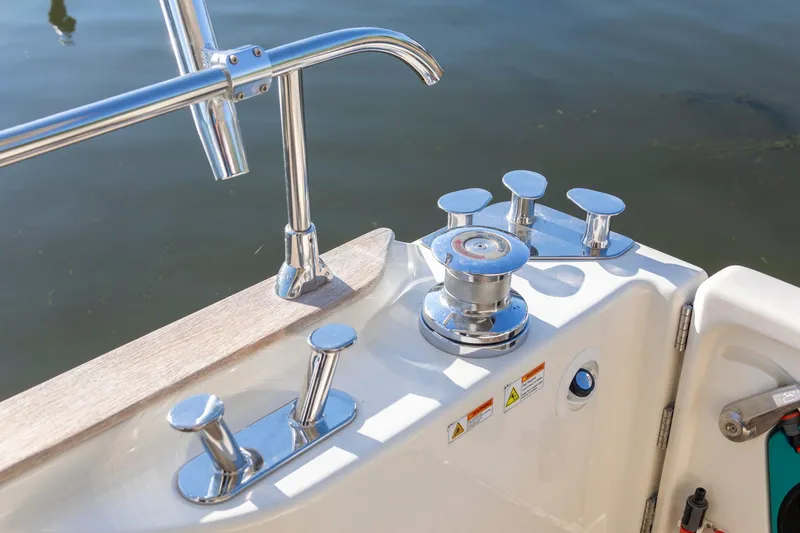 Slide: The Image of Cranchi Eco Trawler 53 Long Distance 2018 deck with polished cleats and winch. - 52