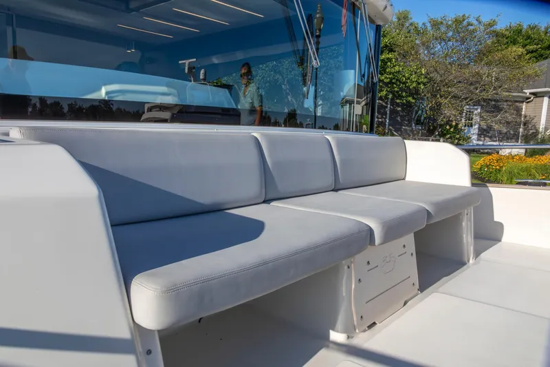 Slide: The Image of 2018 Cranchi Eco Trawler 53 Long Distance yacht with sleek outdoor seating area. - 64