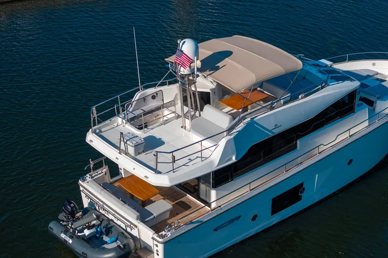 Slide: The Image of 2018 Cranchi Eco Trawler 53 Long Distance yacht on water, featuring spacious deck and modern design. - 7