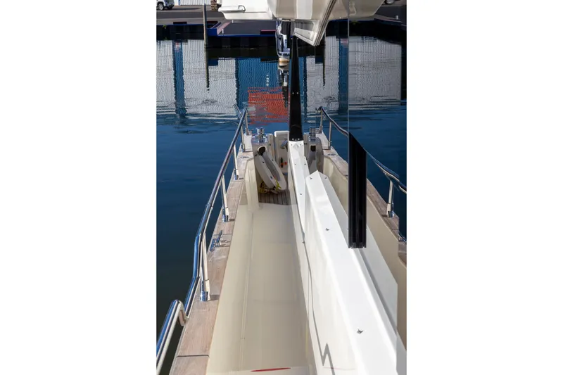Slide: The Image of 2018 Cranchi Eco Trawler 53 Long Distance yacht docked, showcasing sleek deck design. - 74