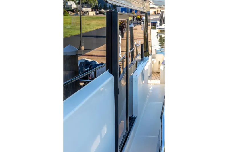 Slide: The Image of 2018 Cranchi Eco Trawler 53 Long Distance yacht docked, showcasing sleek exterior design. - 75