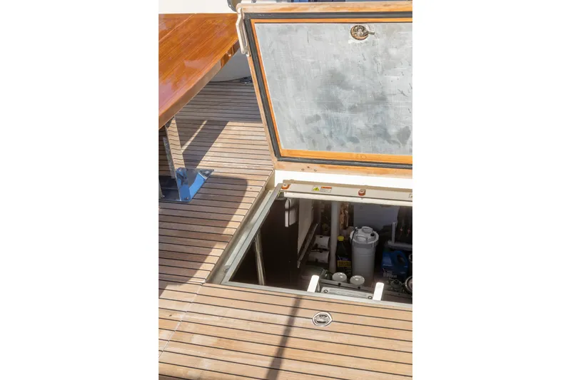 Slide: The Image of Open hatch on 2018 Cranchi Eco Trawler 53 Long Distance, revealing engine compartment. - 79