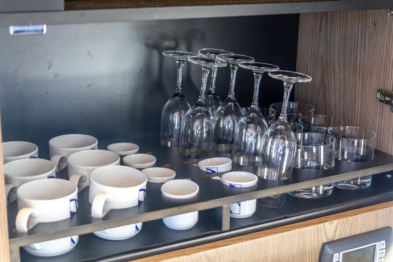 Slide: The Image of Cupboard with neatly arranged cups and glasses on a 2018 Cranchi Eco Trawler 53 Long Distance. - 95