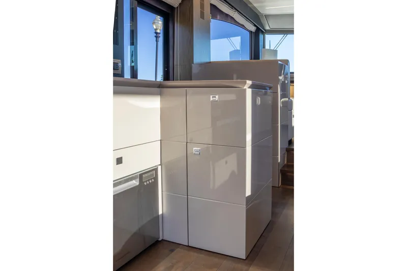 Slide: The Image of Modern interior of 2018 Cranchi Eco Trawler 53 Long Distance yacht, featuring sleek cabinetry. - 99