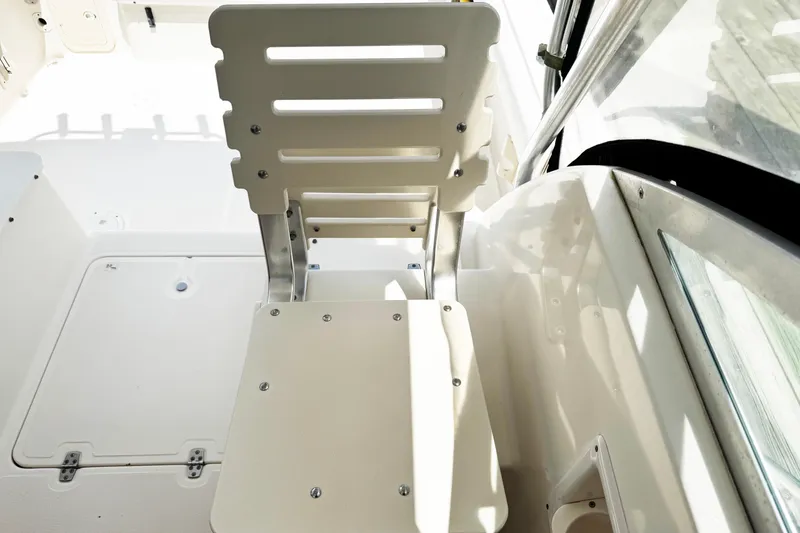 Slide: The Image of 2005 Pursuit 2870 Walkaround boat seat and deck area, showcasing clean design and functionality. - 20