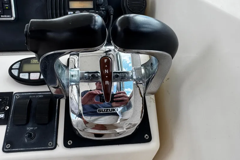 Slide: The Image of Close-up of Suzuki throttle controls on a 2005 Pursuit 2870 Walkaround boat. - 35