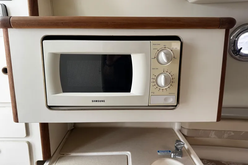 Slide: The Image of Microwave in 2005 Pursuit 2870 Walkaround boat kitchen area. - 40