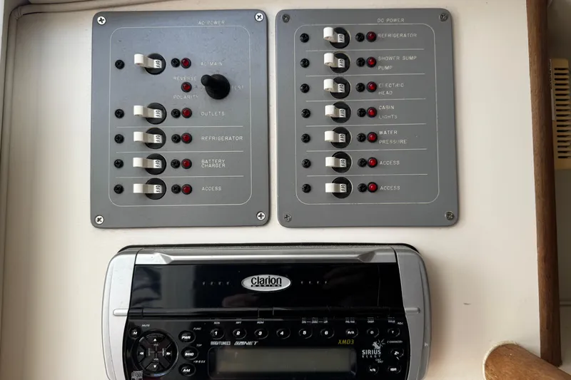 Slide: The Image of Electrical control panel and stereo system on a 2005 Pursuit 2870 Walkaround boat. - 42