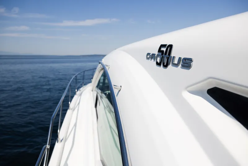 Slide: The Image of 2019 Cruisers Yachts 50 Cantius on open water, showcasing sleek design and branding. - 15