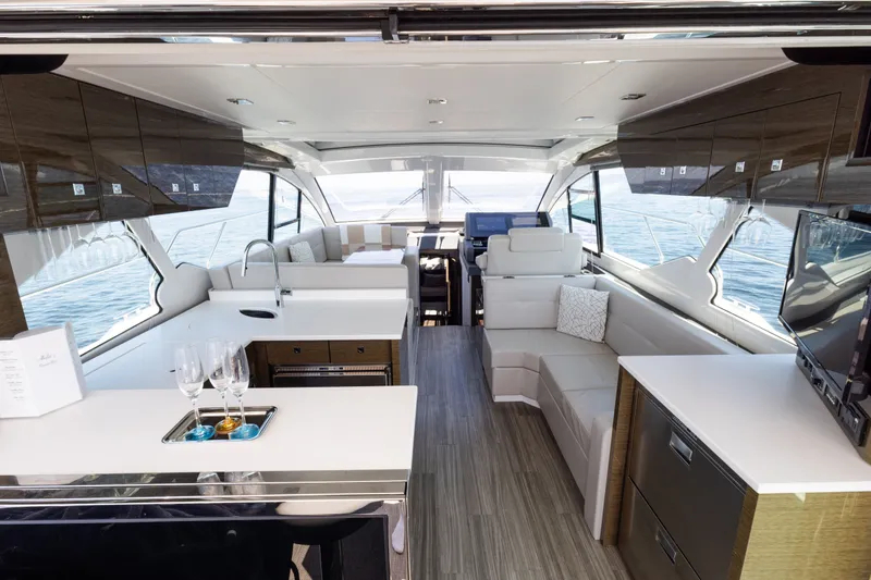 Slide: The Image of Luxurious interior of 2019 Cruisers Yachts 50 Cantius with modern furnishings and ocean view. - 19