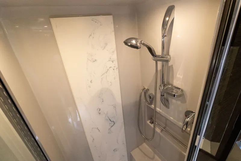 Slide: The Image of Luxurious shower in 2019 Cruisers Yachts 50 Cantius, featuring modern fixtures and elegant design. - 38