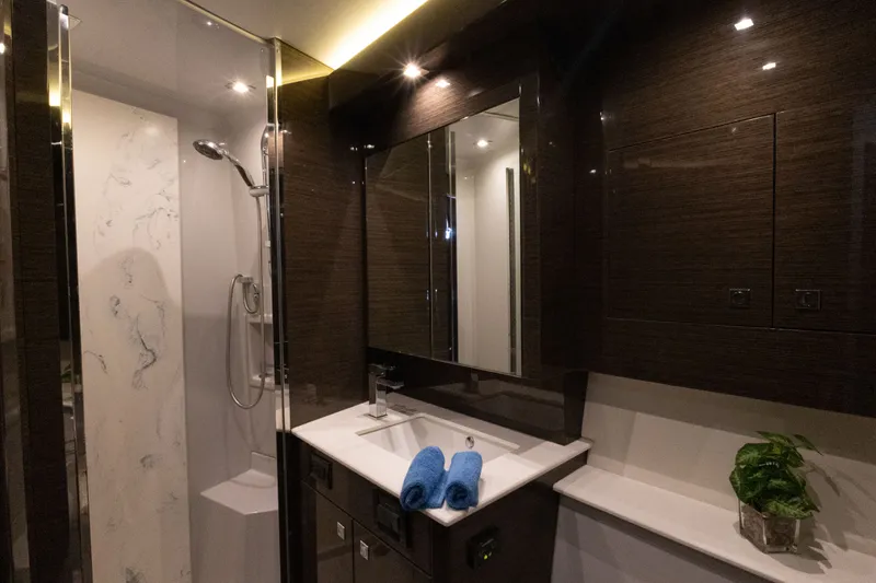 Slide: The Image of Luxurious bathroom in 2019 Cruisers Yachts 50 Cantius with modern fixtures and elegant design. - 39