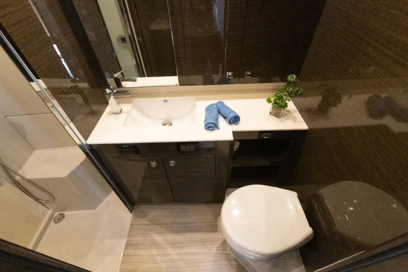Slide: The Image of Luxurious bathroom in 2019 Cruisers Yachts 50 Cantius with modern fixtures and elegant design. - 48