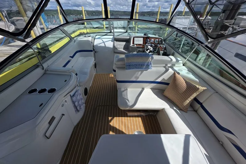 Slide: The Image of 2002 Formula 330 Sun Sport boat interior with seating, steering, and dashboard. - 13