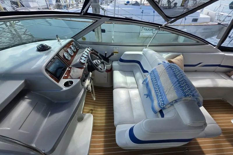 Slide: The Image of 2002 Formula 330 Sun Sport boat interior with plush seating and modern dashboard. - 15