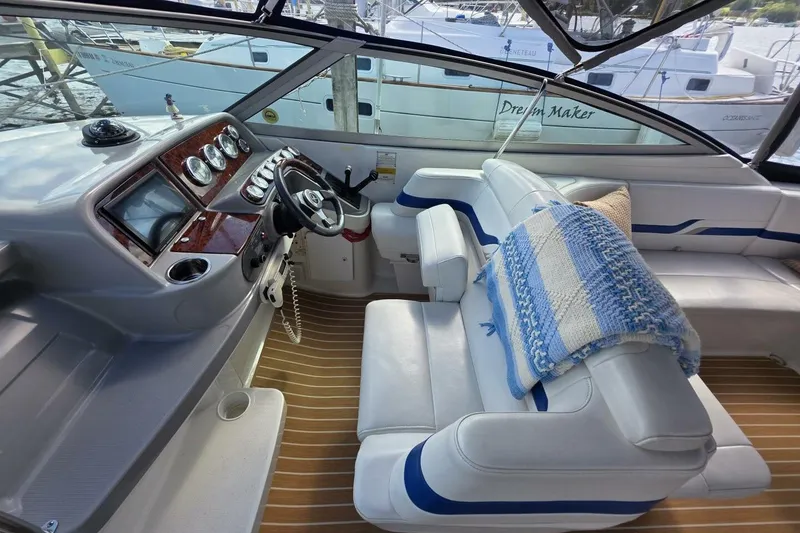 Slide: The Image of Interior of 2002 Formula 330 Sun Sport boat with helm and seating area. - 16