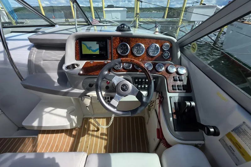 Slide: The Image of Cockpit of 2002 Formula 330 Sun Sport boat with steering wheel and instrument panel. - 17