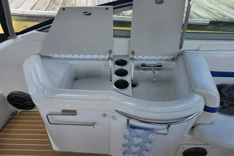 Slide: The Image of 2002 Formula 330 Sun Sport boat interior with sink and cup holders. - 18