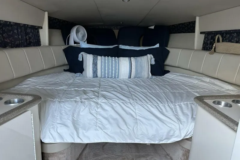 Slide: The Image of Interior cabin of a 2002 Formula 330 Sun Sport boat with cozy bedding. - 19