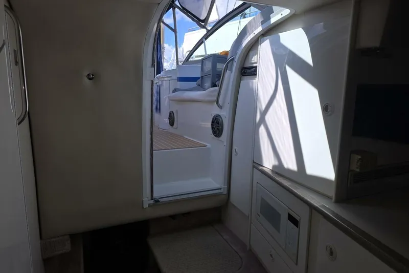 Slide: The Image of Interior view of 2002 Formula 330 Sun Sport boat, showing cabin entrance and kitchenette. - 20