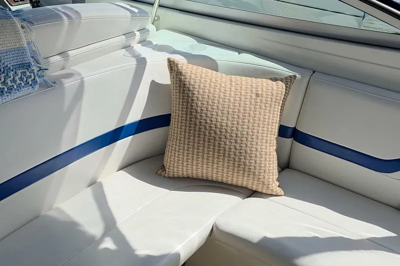 Slide: The Image of Interior of 2002 Formula 330 Sun Sport boat with beige cushion on white seating. - 28