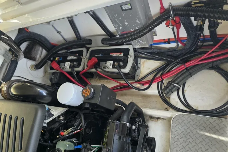 Slide: The Image of Engine compartment of a 2002 Formula 330 Sun Sport with visible wiring and components. - 32