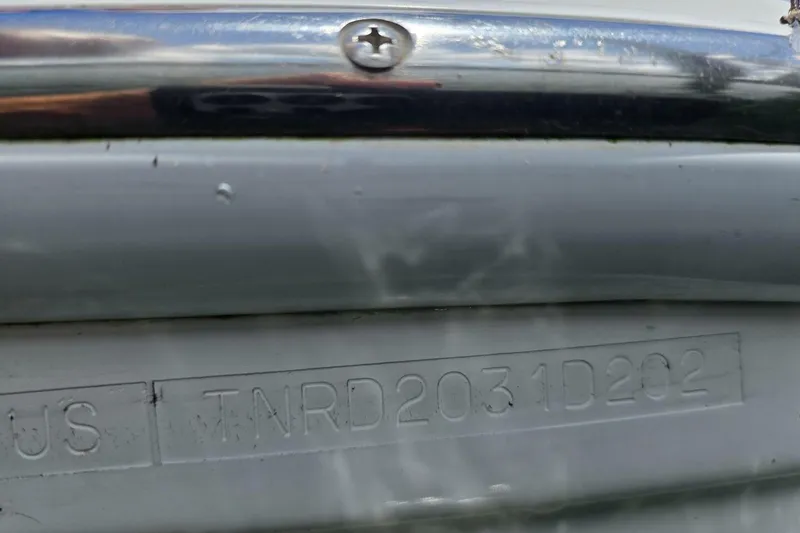 Slide: The Image of Close-up of a 2002 Formula 330 Sun Sport boat hull identification number. - 36