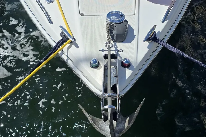 Slide: The Image of Bow of 2002 Formula 330 Sun Sport with anchor and ropes on water. - 8