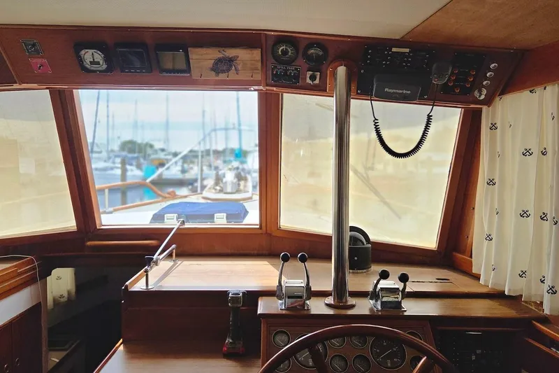 Slide: The Image of Interior helm of 1989 Grand Banks 42 Classic yacht with navigational instruments. - 19