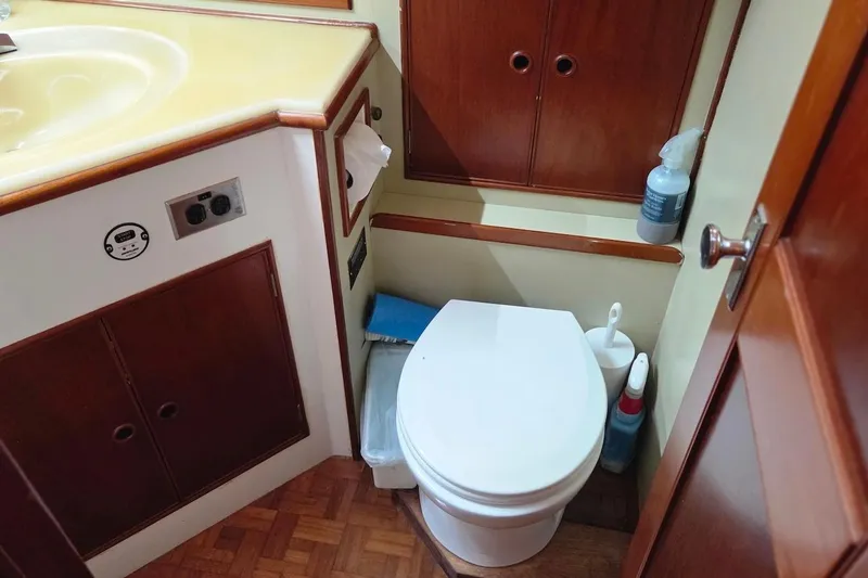 Slide: The Image of Bathroom interior of 1989 Grand Banks 42 Classic yacht with toilet and sink. - 24