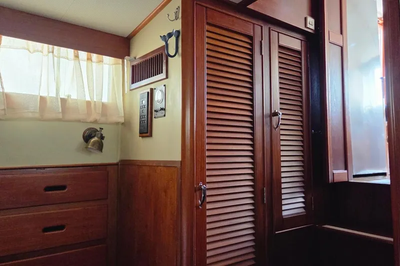 Slide: The Image of Interior of 1989 Grand Banks 42 Classic yacht with wooden cabinetry and soft lighting. - 30