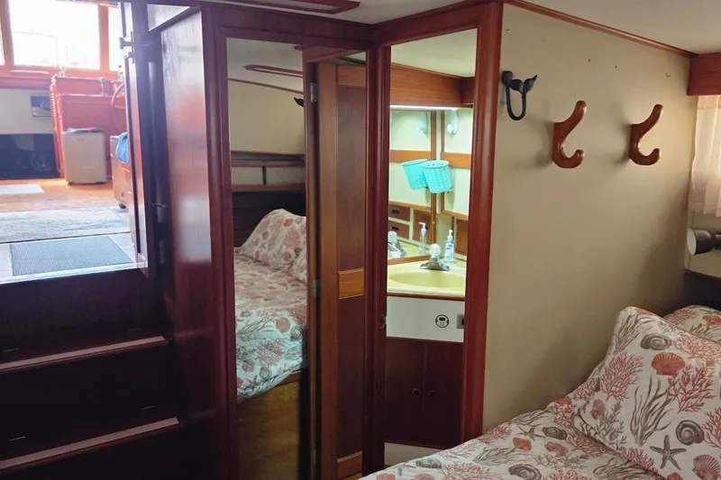 Slide: The Image of Interior of 1989 Grand Banks 42 Classic yacht with cozy bedroom and bathroom. - 31