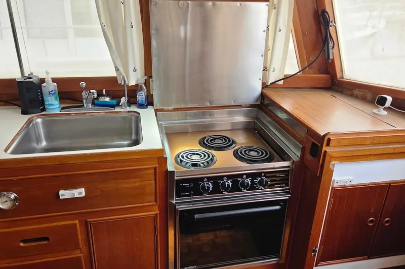 Slide: The Image of Galley kitchen in 1989 Grand Banks 42 Classic yacht with stove and sink. - 36
