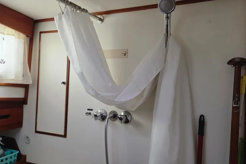 Slide: The Image of Shower area inside 1989 Grand Banks 42 Classic yacht with curtain and fixtures. - 39