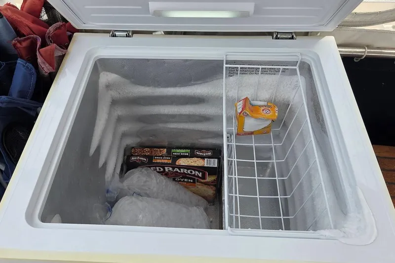 Slide: The Image of Freezer on 1989 Grand Banks 42 Classic yacht with pizza and baking soda. - 51