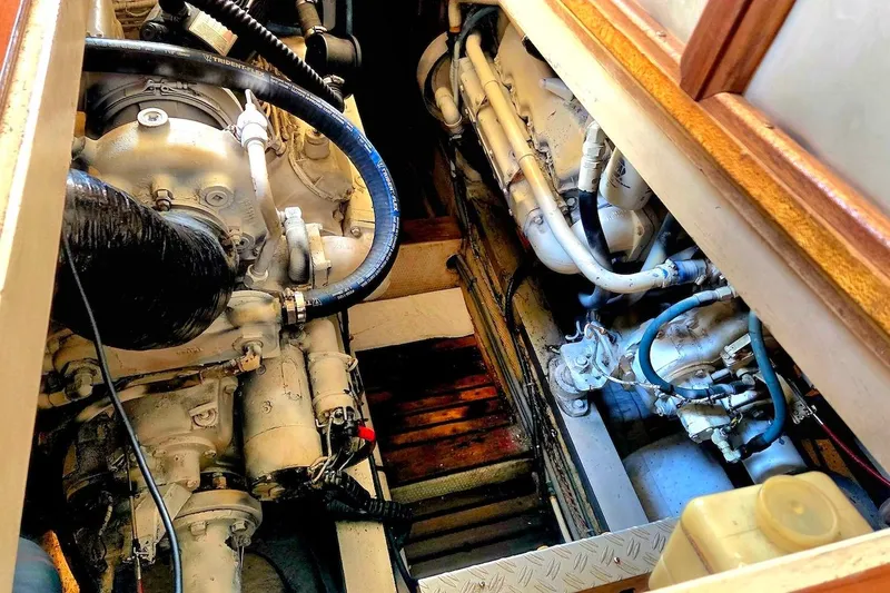 Slide: The Image of Engine room of a 1989 Grand Banks 42 Classic yacht, showcasing dual engines. - 52