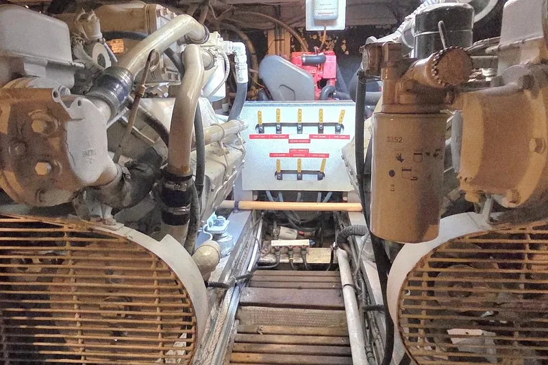Slide: The Image of Engine room of a 1989 Grand Banks 42 Classic yacht, showcasing mechanical components. - 53