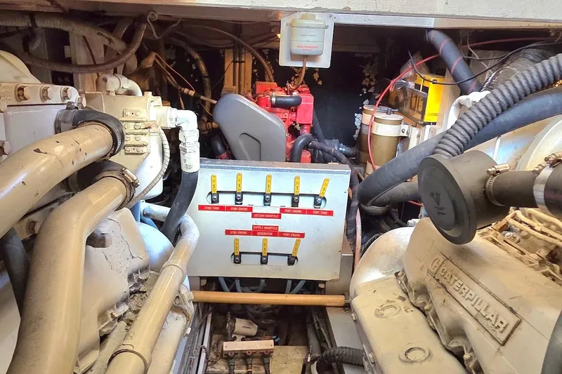 Slide: The Image of Engine room of 1989 Grand Banks 42 Classic with visible components and wiring. - 60