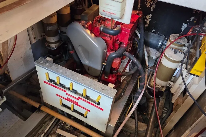 Slide: The Image of 1989 Grand Banks 42 Classic boat propeller and shaft on dry land. - 61