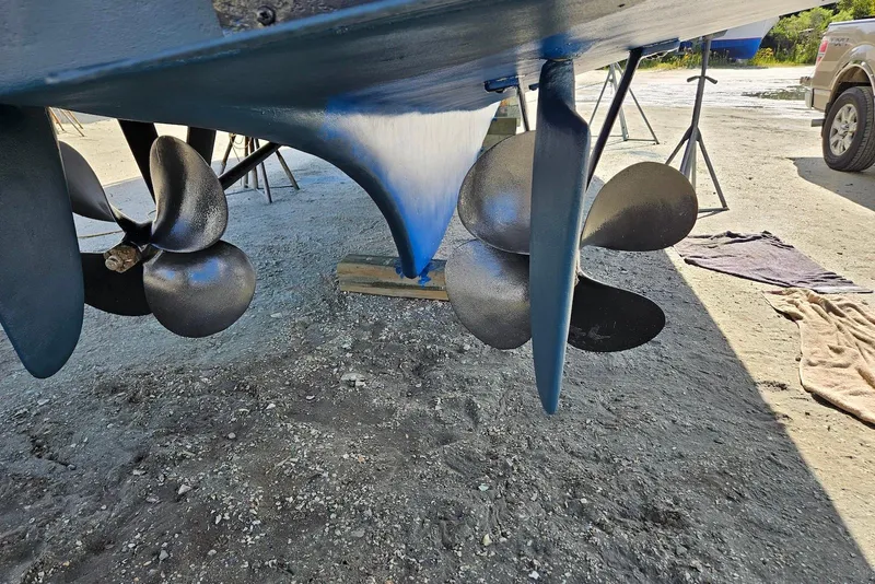 Slide: The Image of Propellers of a 1989 Grand Banks 42 Classic boat on dry land. - 62