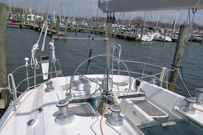 Slide: The Image of Cockpit view of a 1997 Beneteau First 42s7 sailboat docked at a marina. - 6