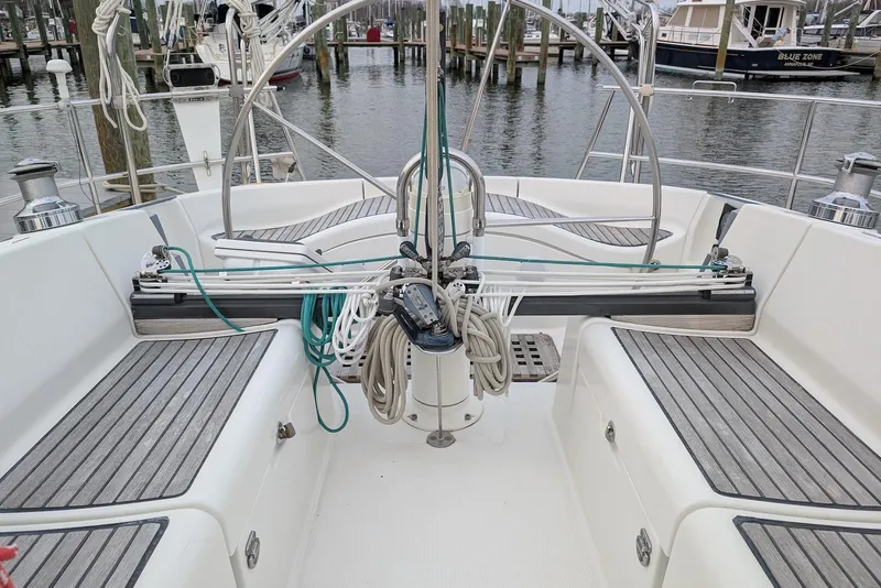 Slide: The Image of Cockpit of a 1997 Beneteau First 42s7 sailboat, featuring teak seating and steering wheel. - 7